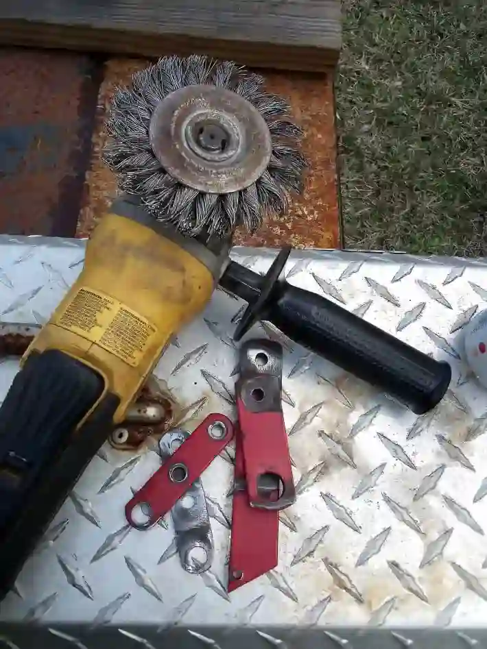 cleaning linkage parts with wire wheel